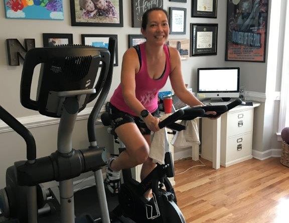 Sitting on my Sunny Fitness and Health spin bike, testing out my Peloton hack.