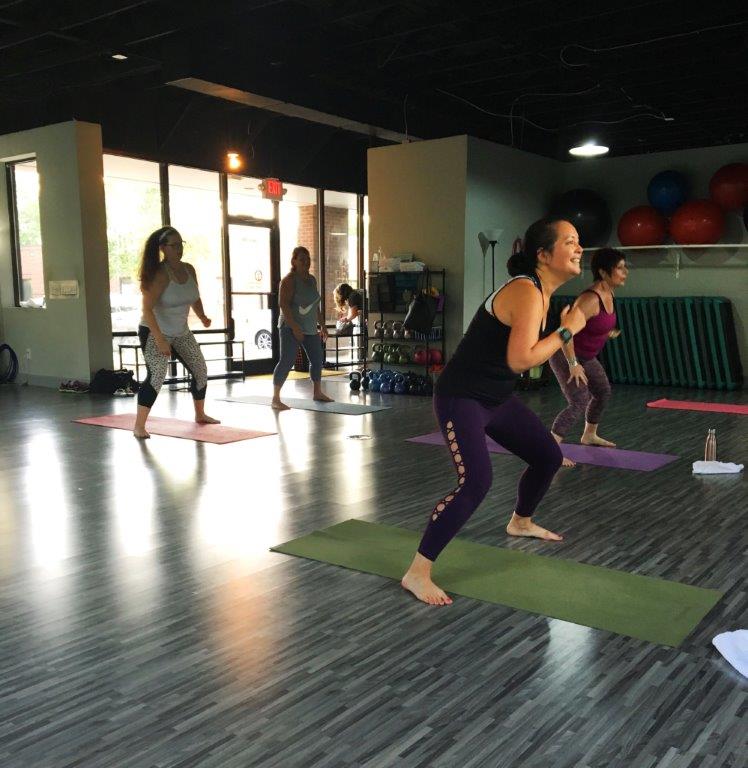 All smiles teaching a PiYo class at Ladies Fitness and Wellness.