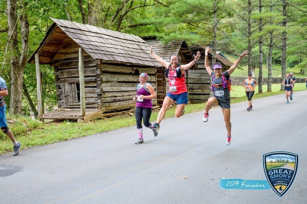 Jumping in the air with a friend during the Great Smoky Mountain half marathon.