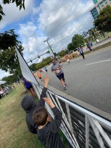 The boys cheering James on from the side as he approached the 5k finish line.