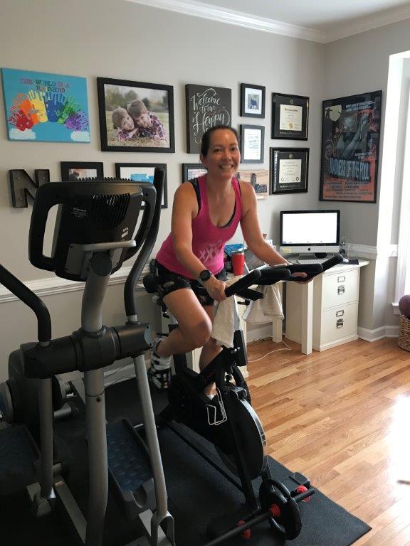 Sitting on my Sunny Fitness and Health spin bike, testing out my Peloton hack.