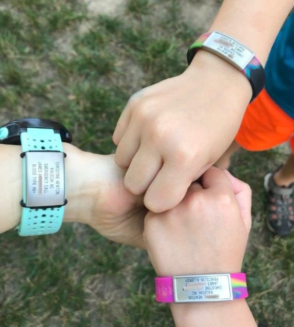 My wrist and the kids, wearing our RoadiDs.