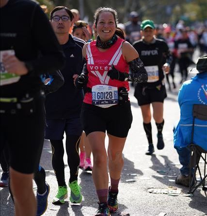 All smiles and wearing my red Oiselle Volee singlet during the New York marathon.